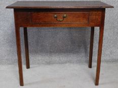 An antique country oak side table with frieze drawer on square supports. H.71 W.82 D.45cm