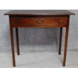 An antique country oak side table with frieze drawer on square supports. H.71 W.82 D.45cm