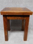 An Eastern hardwood lamp table on square supports. H.60 L.50 W.50cm