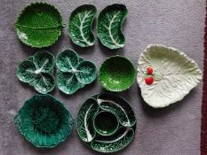 A collection of green glaze Portuguese cabbage ware and other relief leaf design pieces. Including