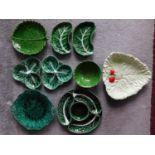 A collection of green glaze Portuguese cabbage ware and other relief leaf design pieces. Including