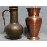 A vintage hammered copper handled jug along with a hammered copper vase with fluted edge. H.47cm
