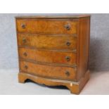 A Georgian style burr walnut chest of four long drawers on shaped bracket feet. H.82 W.79 D.50cm