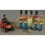 A toy model of a marching band and a tinplate vintage car. 21x25cm (car)