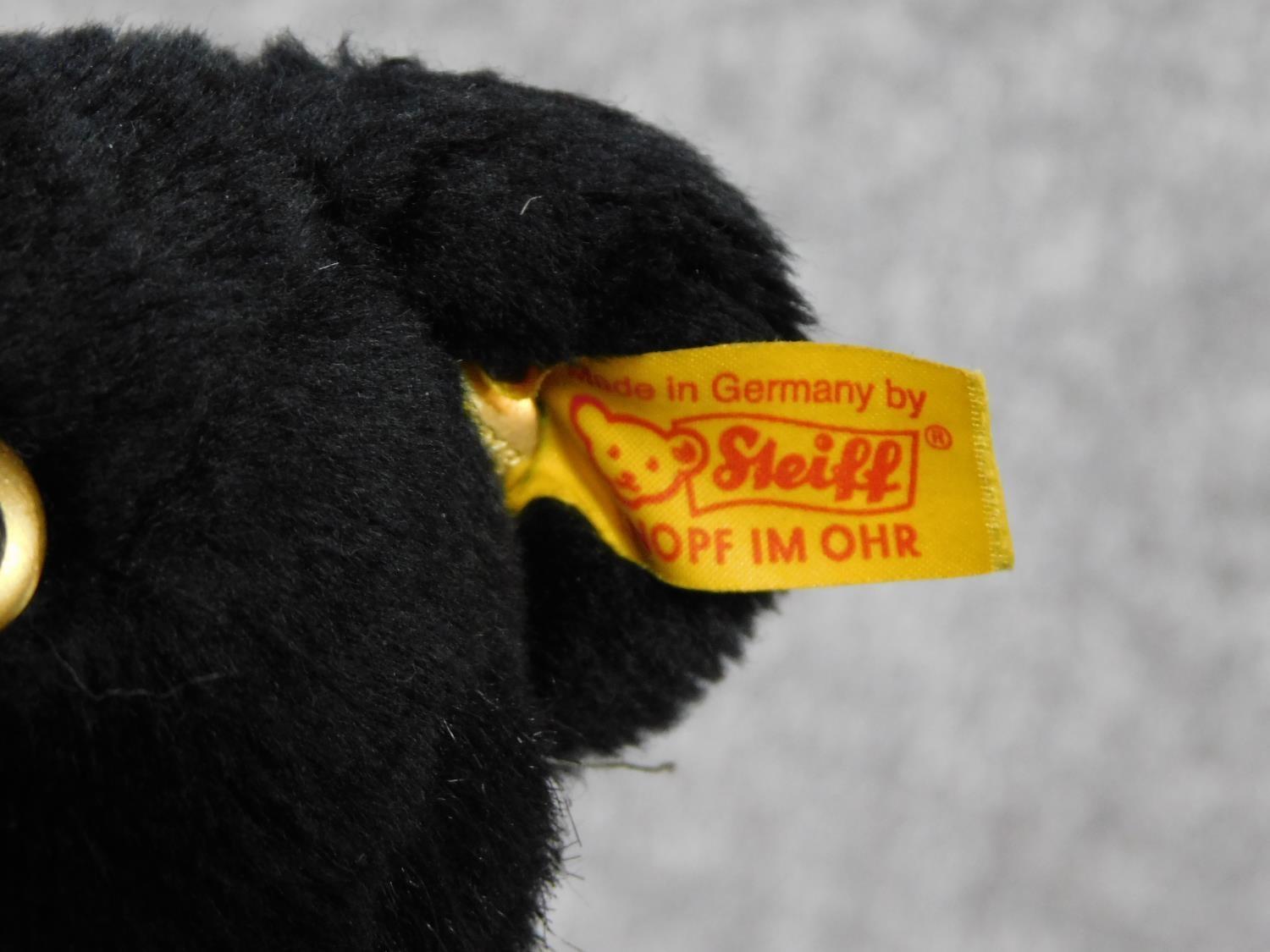 A Steiff vintage toy of a young black panther. With label and gold button. Plastic eyes. W.31cm - Image 2 of 4