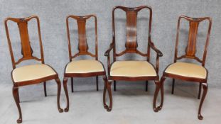 A set of four Edwardian mahogany and satinwood inlaid dining chairs carved to the back on cabriole