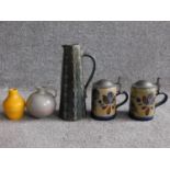 A collection of West German pottery. Including two salt glaze German steins with pewter lids and
