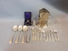 A collection of silver plate items. Including an antique razor ,a pierced two handled wine bottle