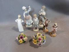 A collection of porcelain Lladro figures and ornaments. Including two porcelain flower baskets one