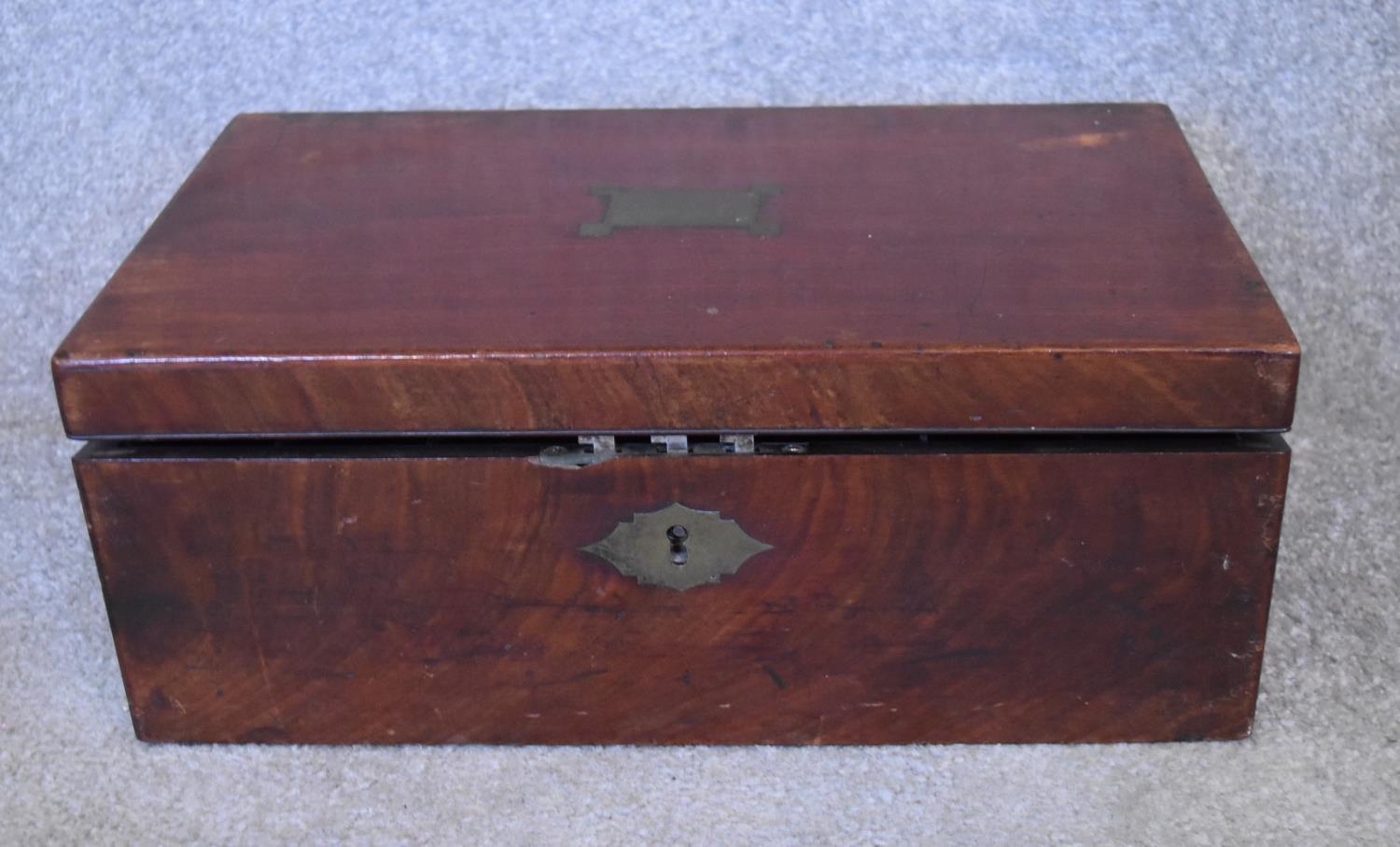 A Georgian mahogany writing slope with original keys, lacks interior. H.16 x 40cm