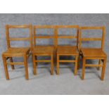 Four vintage oak children's school chairs on square stretchered supports. H.69cm