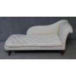 A Victorian mahogany chaise longue with buttoned squab cushion on turned tapering supports. H.79xW.