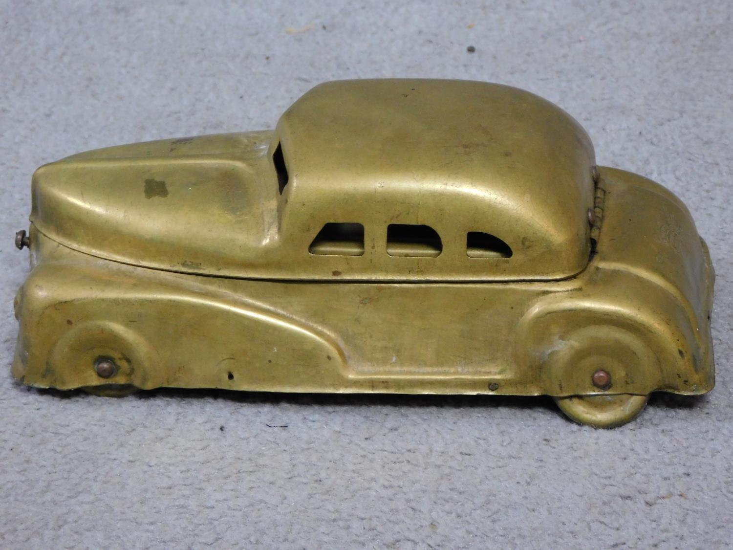 A vintage brass Betel Motor Car artist's box. Has hinged lid and removable palettes. One of the