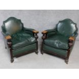 A pair of mid 20th century carved oak frame leather upholstered armchairs on bulbous reeded