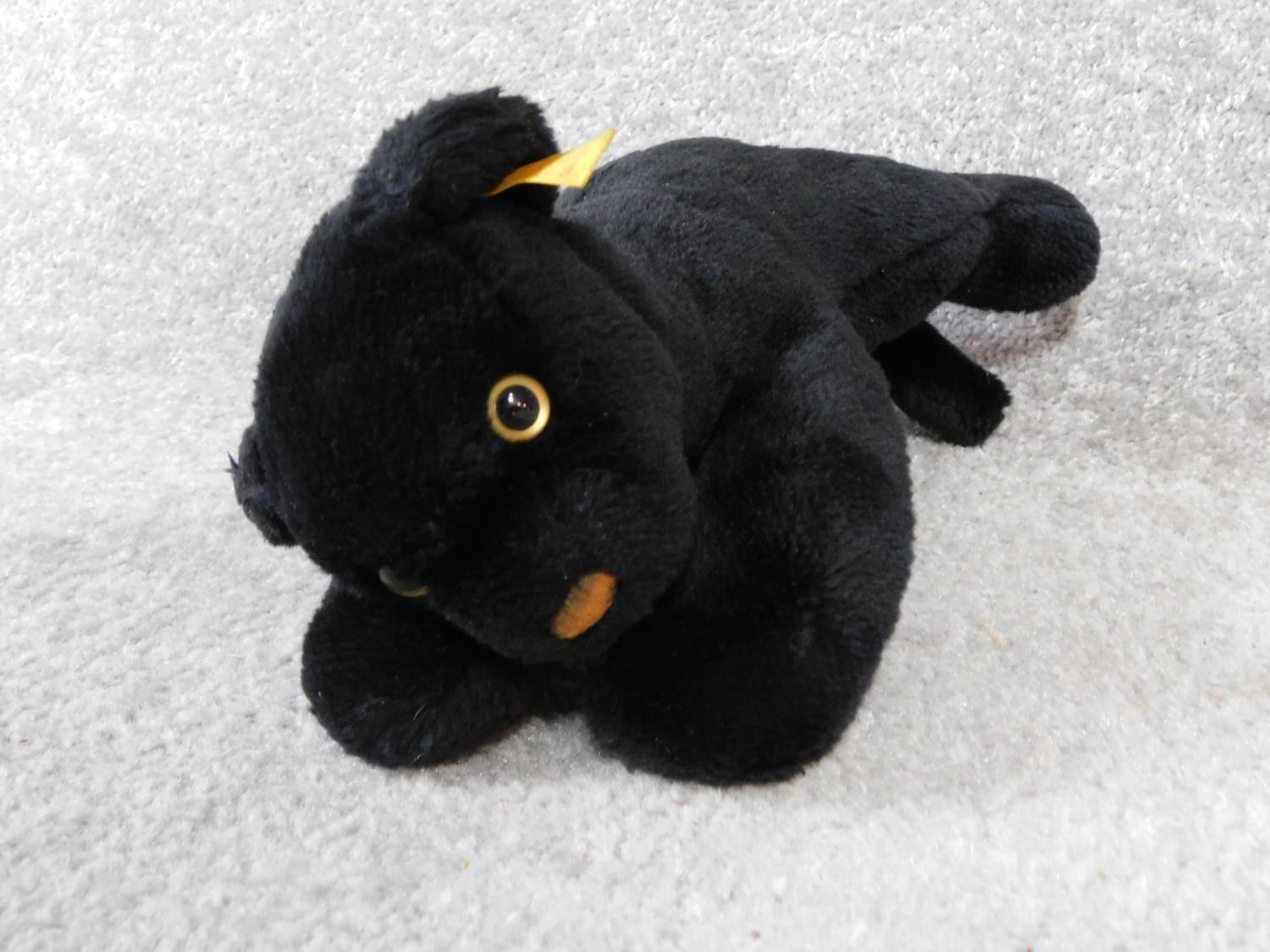 A Steiff vintage toy of a young black panther. With label and gold button. Plastic eyes. W.31cm - Image 4 of 4