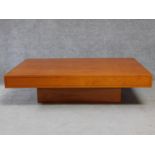 A contemporary teak rectangular coffee table on plinth base. H.38 L.140 W.90cm