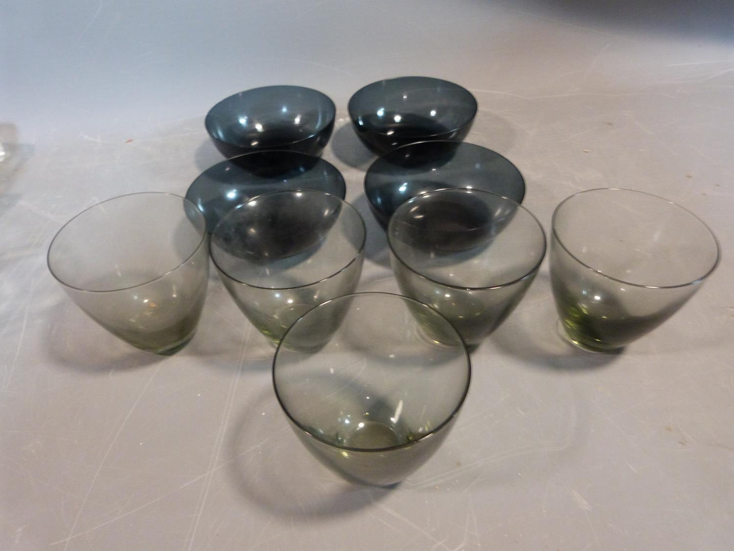 Six mid century glass blue grey bowls and six smokey grey drinking glasses. Possibly Danish. H 9.