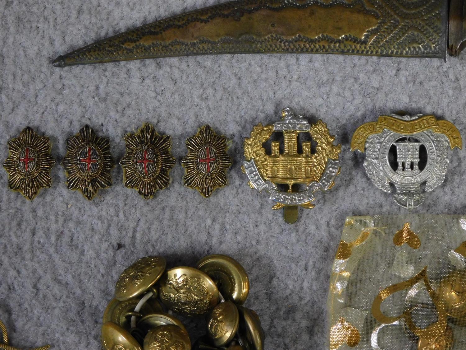 A collection of military regalia and brass buttons along with a bone handled dagger with hammered - Image 2 of 4