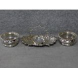 A pair of Martin Hall & Co Georgian pierced silver plated wine coasters with oak bases and a