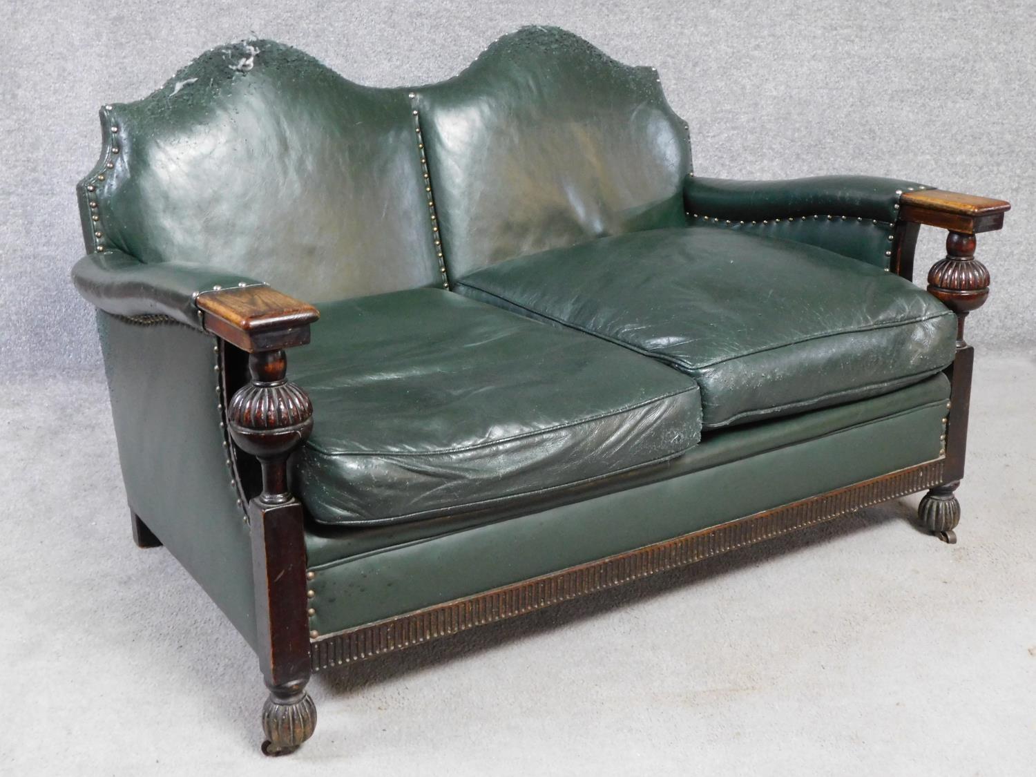 A mid 20th century carved oak frame leather upholstered two seater sofa on bulbous reeded - Image 3 of 7
