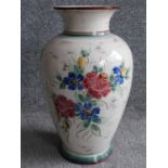 A vintage German ceramic vase with hand painted floral design. Stamled 47340, Germany to the base.