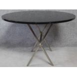 A contemporary marble top table with folding chrome base. H.63 L.91 W.91cm