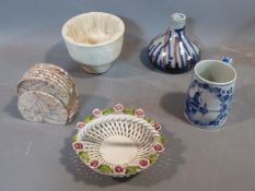 A collection of studio pottery. Including an antique ceramic jelly mould, woven Italian ceramic