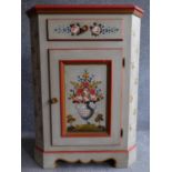 A Continental style hand painted corner cabinet with frieze drawer above panel door on shaped