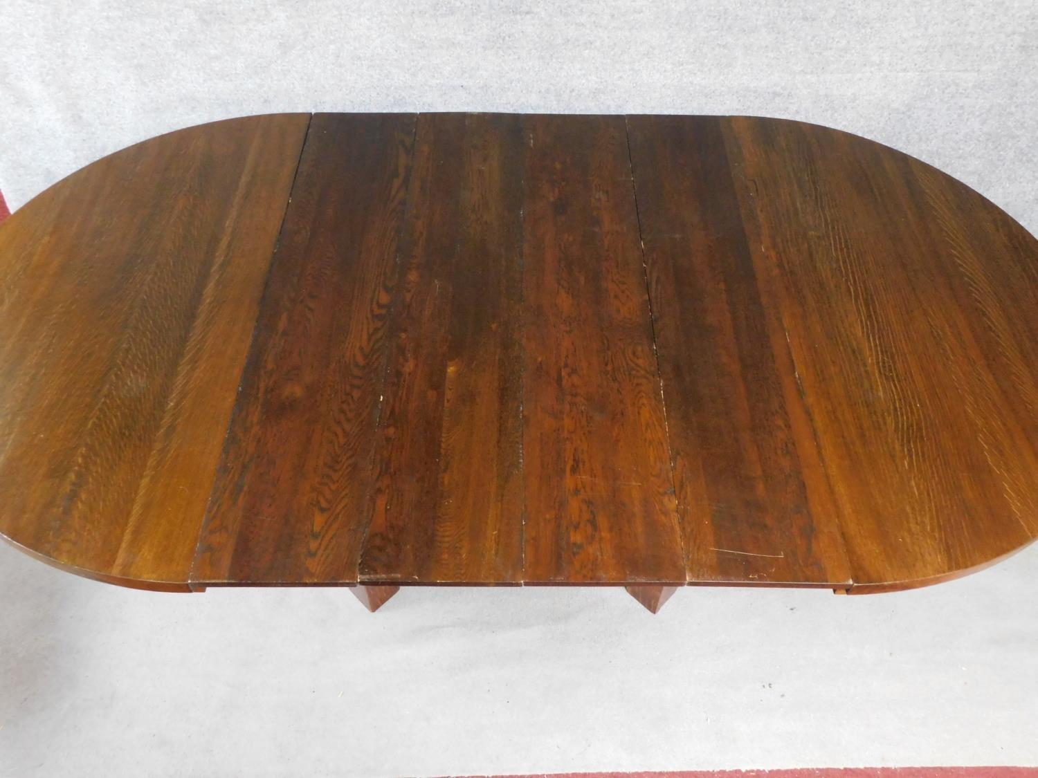 An American Arts and Crafts Mission style oak extending table with four extra leaves. H.72 W.249 D. - Image 2 of 7