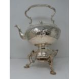 An antique white metal and ivory spirit kettle and stand. The kettle has a flower bud finial and