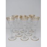 A set of eight St Louis crystal sherry glasses, with gilded scalloped detailing and gilded edge to