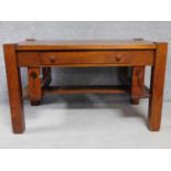 An American Arts and Crafts Mission style oak desk. Fitted with central frieze draw with book