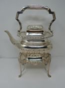 An Elkington & Co Victorian silver kettle and stand with burner. Ivory details and repousse