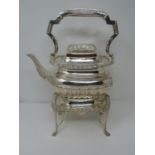 An Elkington & Co Victorian silver kettle and stand with burner. Ivory details and repousse