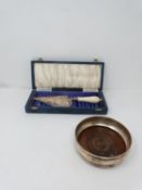 A vintage silver and ivory ceremonial leather effect cased trowel and wine coaster. Trowel has