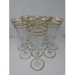 A set of eleven St Louis Excellence crystal large wine glasses, with gilded scalloped detailing