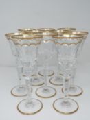 A set of ten St Louis Excellence crystal wine glasses, with gilded scalloped detailing and gilded