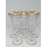 A set of ten St Louis Excellence crystal wine glasses, with gilded scalloped detailing and gilded