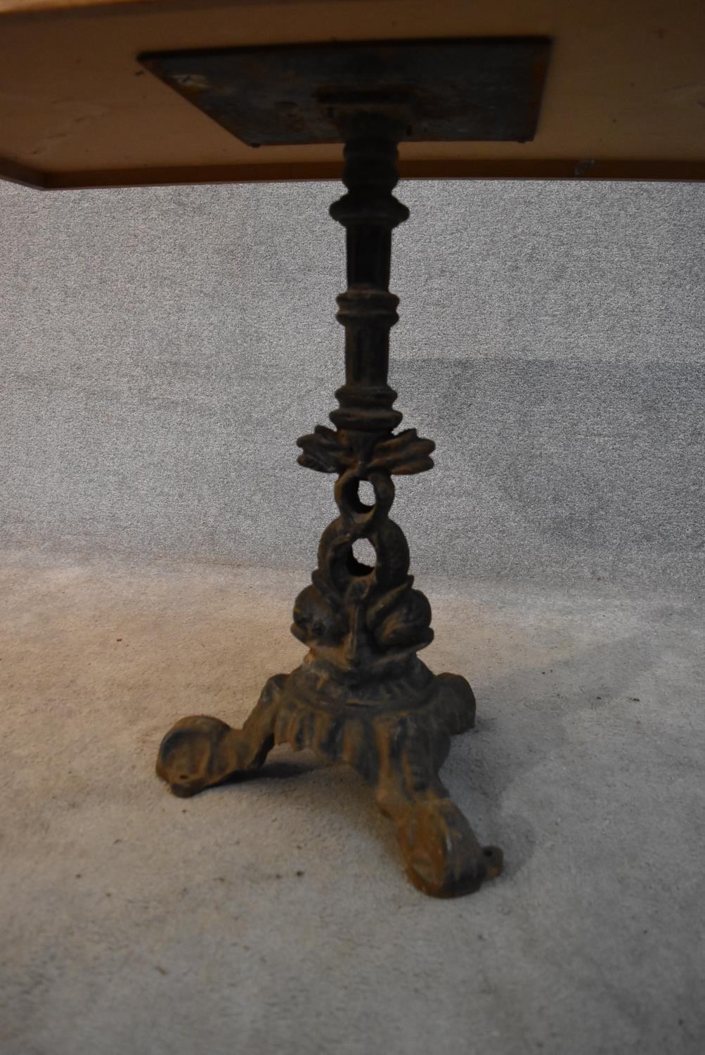 An oak topped conservatory table with cast iron pedestal base formed of entwined dolphins. H. - Image 3 of 3