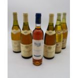 Six various bottles of wine to include1979 Chablis Premier Cru, 1988 Meursault and others.