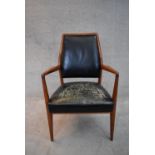 A mid 20th century vintage Danish teak framed armchair in leather upholstery. H.90x68cm