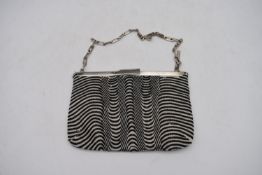 A vintage Gucci ladies evening bag, with black and white beaded design, H.15 W.22cm, with some