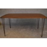 A retro style elm topped dining table on metal hairpin supports. H.73x150x76cm