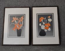 A pair of framed and glazed prints, flowers, signed by the artist. H.58x42cm