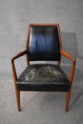 A mid 20th century vintage Danish teak framed armchair in leather upholstery. H.98x60cm