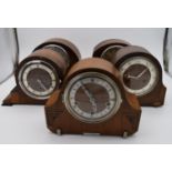 A collection of five mid 20th century mantel clocks with English brass movements. Some have roman