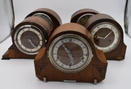 A collection of five mid 20th century mantel clocks with English brass movements. Some have roman