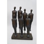 A moulded figure group, two rows of men, H.46x30cm