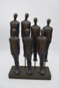 A moulded figure group, two rows of men, H.46x30cm