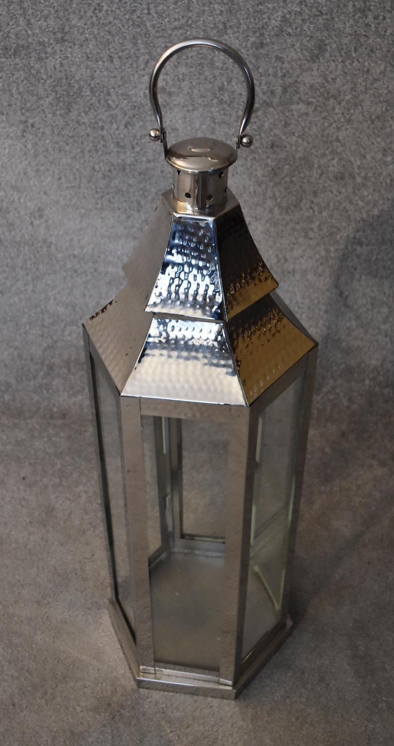 A tall metal framed storm lantern. H.88cm - Image 2 of 3